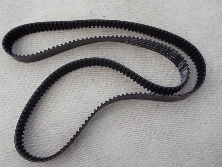 S5M1420 Timing Belt - a black, toothed rubber belt looped in a figure-eight shape on a light-colored surface with visible white text markings.