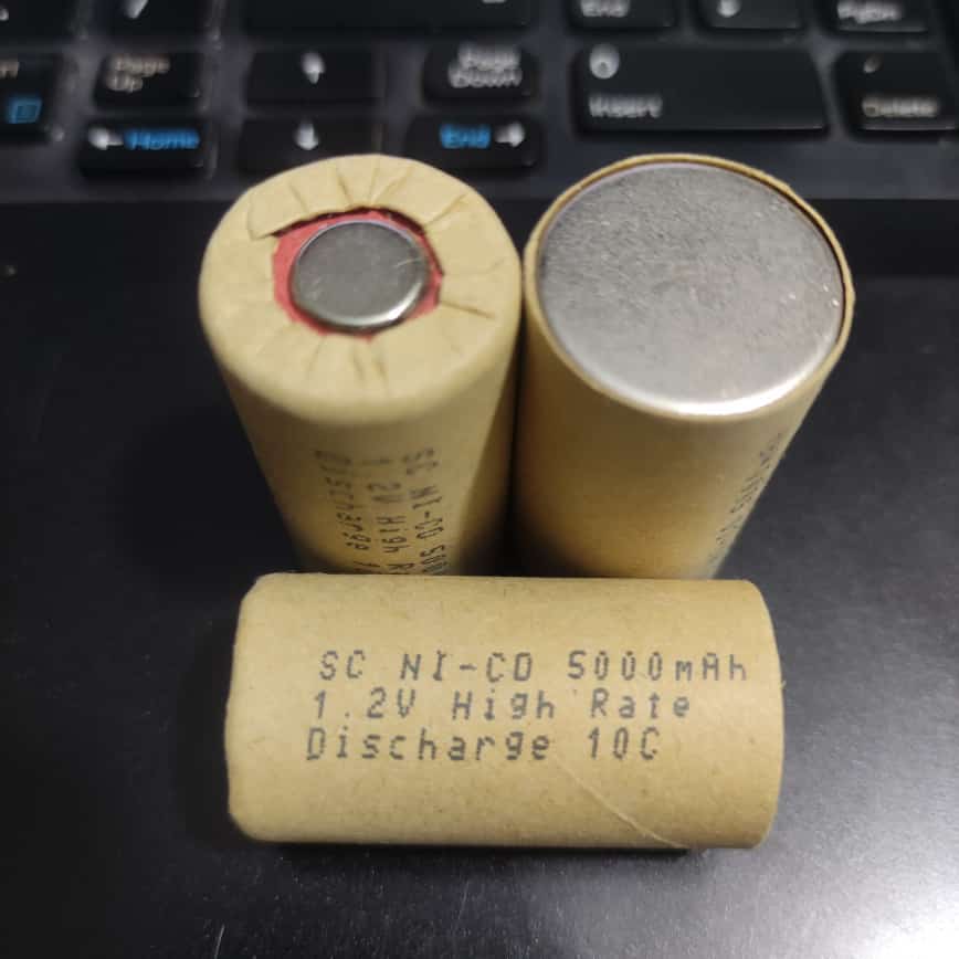 SC Size 5000mAh 1.2V Ni mh Rechargeable Battery - three tan-colored cylindrical cells with specifications printed on the side.
