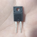 SC0665F 650V 6A SiC Schottky Diode TO-220F - a black, rectangular electronic component with two metal pins and a mounting hole, held against a human palm.