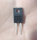 SC0665F 650V 6A SiC Schottky Diode TO-220F - a black, rectangular electronic component with two metal pins and a mounting hole, held against a human palm.