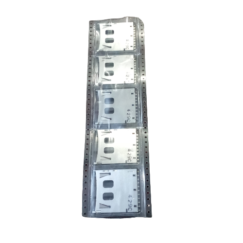 SD memory card slot card - shown as five silver metal components sealed in a clear plastic carrier tape strip.