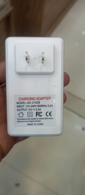 security monitoring 5V 2amp battery - a white rectangular wall plug with two metal prongs and printed technical specifications on the front.