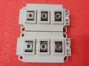 Semikron 300A Infineon FF300R12KT4 IGBT Module, 1200 V | Digilog.pk - two white rectangular power electronic modules with three metal terminals and two small side pins.