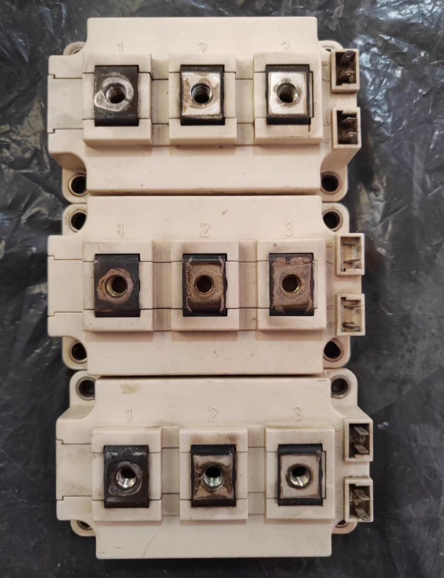 Semikron 300A Infineon FF300R12KT4 IGBT Module, 1200 V | Digilog.pk - three stacked beige rectangular power modules with numbered terminals and side-mounted connectors.