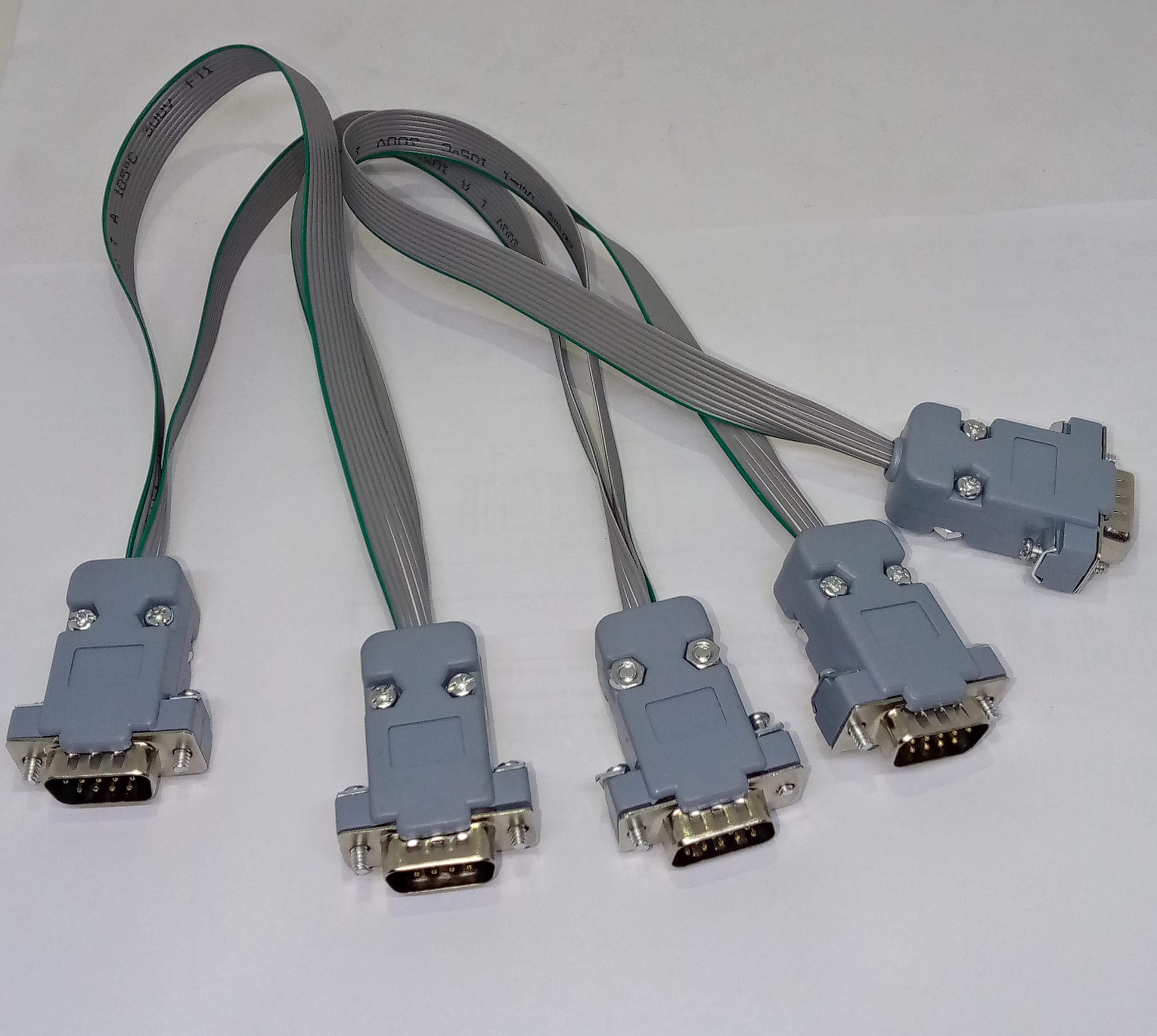 Serial Modbus Daisy Chain Cable - shown as a grey ribbon cable with five grey DB9 serial connectors attached at intervals.