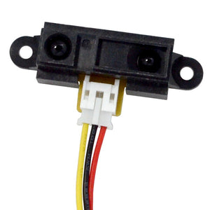 Sharp Distance Measuring Sensor unit 10 to 80 cm – GP2Y0A21YK0F - a black rectangular sensor module with two circular lenses and a white three-pin connector with attached wires.