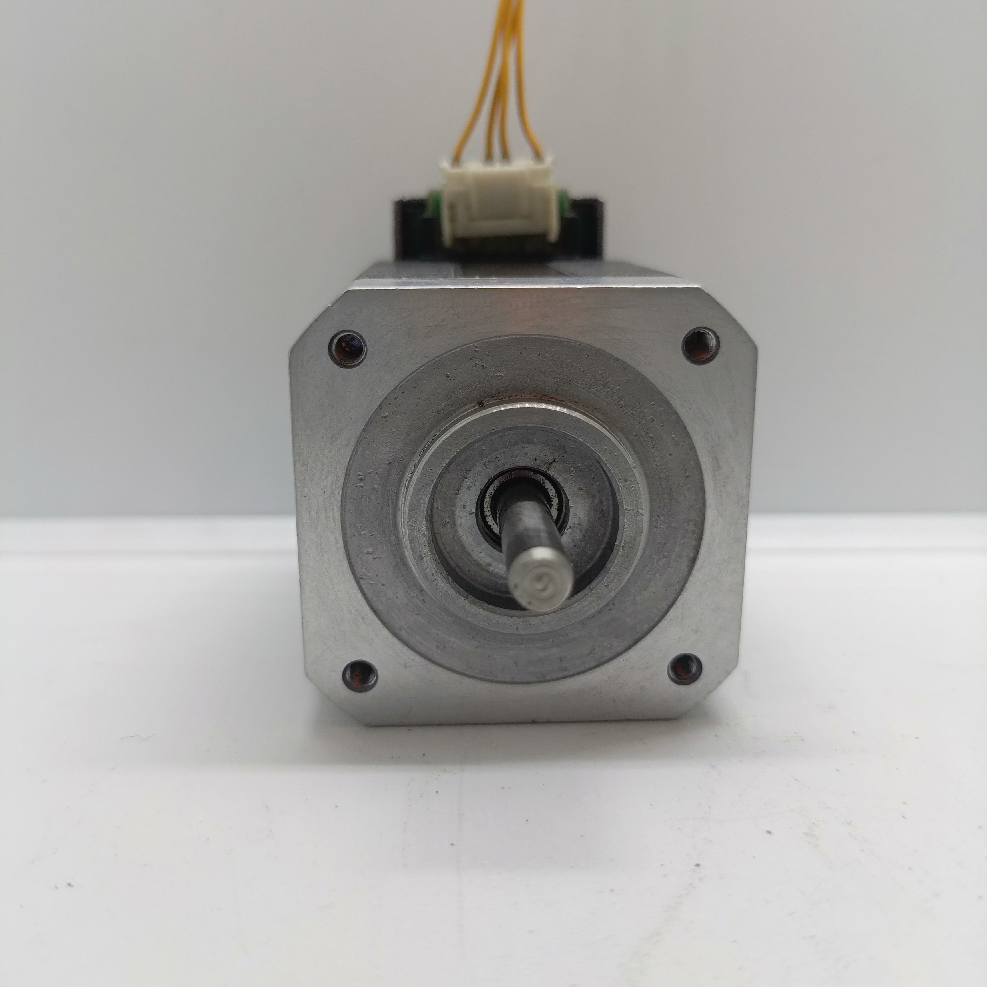 Shinano Kenshi STP-42D4042 2A 1.8 Degree Per Step 0.53nm Stepper Motor - the silver square front face, central rotating shaft, four mounting holes, and a top white wire connector.