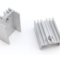 Silver Aluminium To 220 Heat Sink - two pieces of silver-coloured aluminium heat sinks with threaded mounting holes.