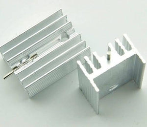 Silver Aluminium To 220 Heat Sink - two silver-coloured, finned metal heat sinks with mounting holes, one with a metal pin inserted.