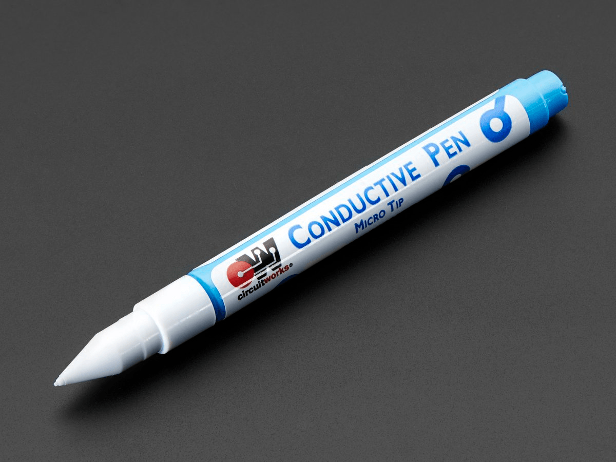 Silver Conductive Ink Pen CW2000 - a white and blue felt-tip marker with a micro tip, shown diagonally against a dark grey background.