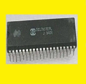 Simple Digital Voltmeter IC ICL7107 - a black rectangular integrated circuit with two rows of metal pins, shown in a top-down view against a yellow background.