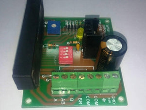 Sine Wave STK672-050 3amp Unipolar 6 Wires Stepper Motor Driver - a green PCB with a black heatsink, a red DIP switch, and green screw terminals.