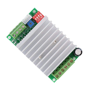 Single Axis TB6600 4.5A DC 12V To 45V Two Phase Hybrid Stepper Motor Driver Controller - a green circuit board with a large silver heatsink, a four-switch DIP block, a blue potentiometer, and screw terminals.