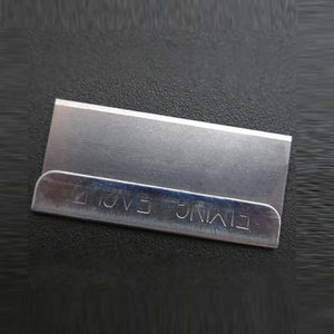 Single Edge Safety Razor Blade For Mobile Phone Repairing Opening Frame Cutting Polarizer Film Remover Tool - a close-up of a rectangular metal blade with a reinforced spine stamped with the text Flying Eagle on a dark background.