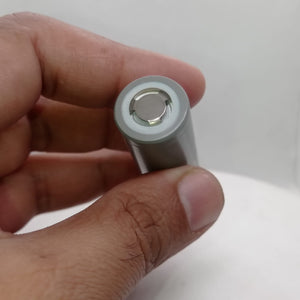 Sinowatt SW18650-30SP 3000mAh High Discharge Rate Cell - a close-up view of the cylindrical battery's positive terminal end held between fingers.