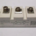 SKM100GB128D 145A 1200V Semikron IGBT Module - a white rectangular power electronic component with three top screw terminals and side blade connectors.