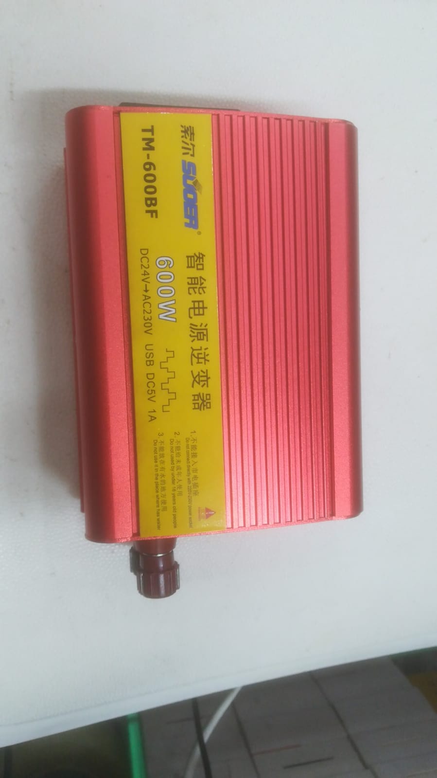 Smart Power Inverter 600W | Efficient & Reliable | Digilog.pk - a red rectangular device with a yellow label displaying specifications including DC24V to AC230V and a USB DC5V 1A port.
