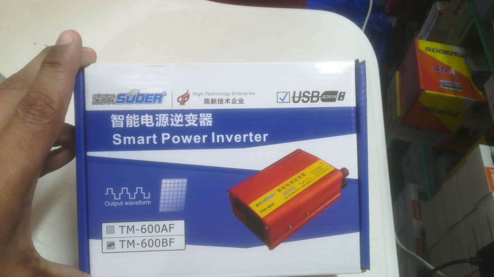 Smart Power Inverter 600W | Efficient & Reliable | Digilog.pk - a red inverter unit, USB port icon, and model labels TM-600AF and TM-600BF.