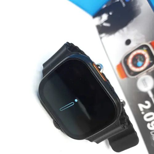 Smart Watch T900 Ultra 2.09 Inch Big Display Bluetooth Calling Series 8 With All Sports Features & Health Tracker - Smart Watch Ultra Infinite Display - a black screen with a small blue indicator icon, positioned next to its product packaging box.