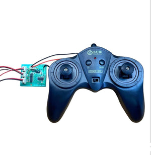 SNRM92 (C version) 1.2A low-power remote control kit 6-channel 2.4G - a black gamepad controller with two joysticks, an on/off switch, and a connected green circuit board.