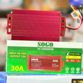 SOGO 30A DC Converter | 48-72V to 12V Step Down Voltage Regulator - a red rectangular voltage regulator with wires, sitting on top of its green and white product packaging box.