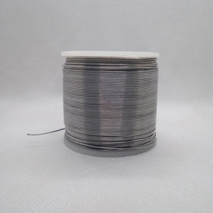 Solder Wire - High Quality 63-37 Professional Solder 400G | digilog.pk - shown as a large spool of thin, silver-colored metal wire wound around a cylindrical core.