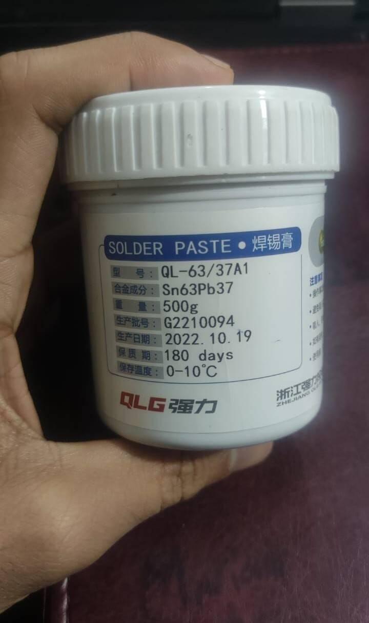 Soldering Flux Paste 500gram Soldering Tin Qlg Factory Solder Welding Rosin Flux SN63PB37 - shown in a white plastic jar with a label detailing the Sn63Pb37 alloy, production date, and storage specifications.
