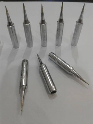 Soldering Iron Bit Kd-m-i - shown as a collection of seven silver-colored, pointed metal soldering tips arranged on a white surface.