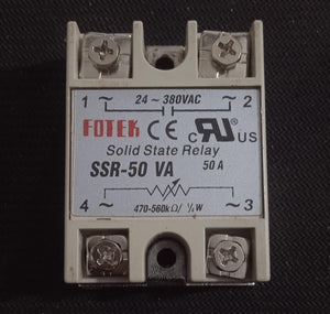 Solid State Relay 50VA Solid State AC Dimmer - a grey rectangular relay with four screw terminals and a label showing voltage and resistance specifications.