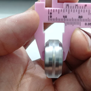 Solid V Wheel For 4040 Aluminum Profile Transparent - shown in a close-up being measured by a pink plastic vernier caliper.