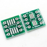 SOP8 SSOP8 TSSOP8 SMD to DIP8 PCB for Programmer - two small green rectangular circuit boards with numbered pins and 0.65mm markings.