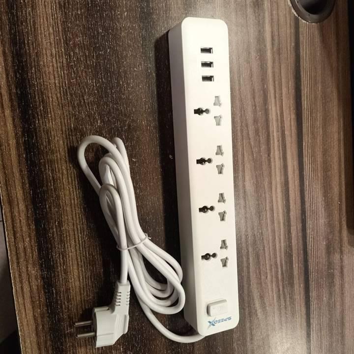 Speed X403PU Premium Portable Power Strip 4socket 3usb Port - a white power strip with four universal sockets, three USB ports, a power switch, and a power cord.