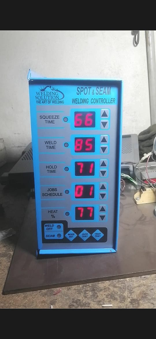 Spot/SEAM Welding Control Panel - blue metal case with five digital displays showing 66, 85, 71, 01, and 77, plus buttons and indicator lights.