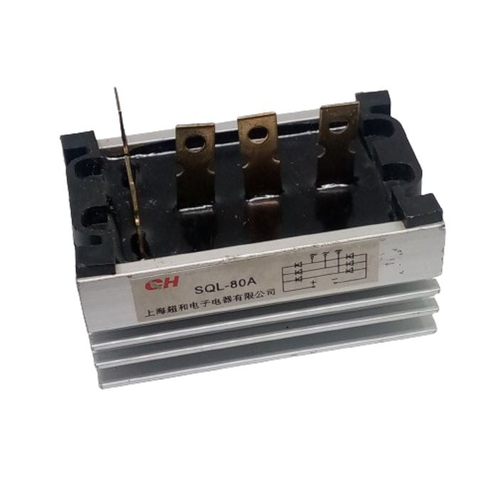 SQL-80A THREE PHASE BRIDGE - a silver metallic rectifier with a black top, four vertical metal terminals, and a label showing a circuit diagram.