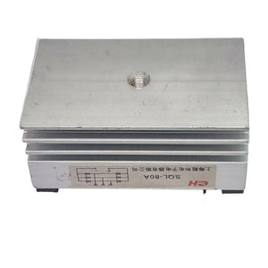 SQL-80A THREE PHASE BRIDGE - a silver metallic rectangular rectifier with a central screw hole and a side label showing a circuit diagram and text.
