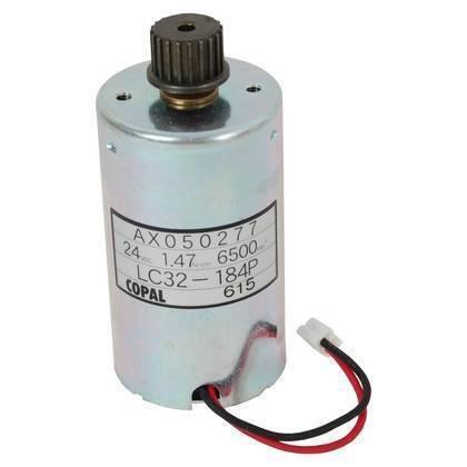 SR5000 DC Motor - 24 Volt 9.9W - Old Style - a cylindrical silver motor with a black gear on top and two wires with a white connector extending from the bottom.