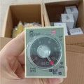 (st3p A-b) Analogue Timer/time Delay Relay - a circular dial marked 0-10 SEC, an adjustment knob, UP and ON indicator lights, and cardboard boxes.