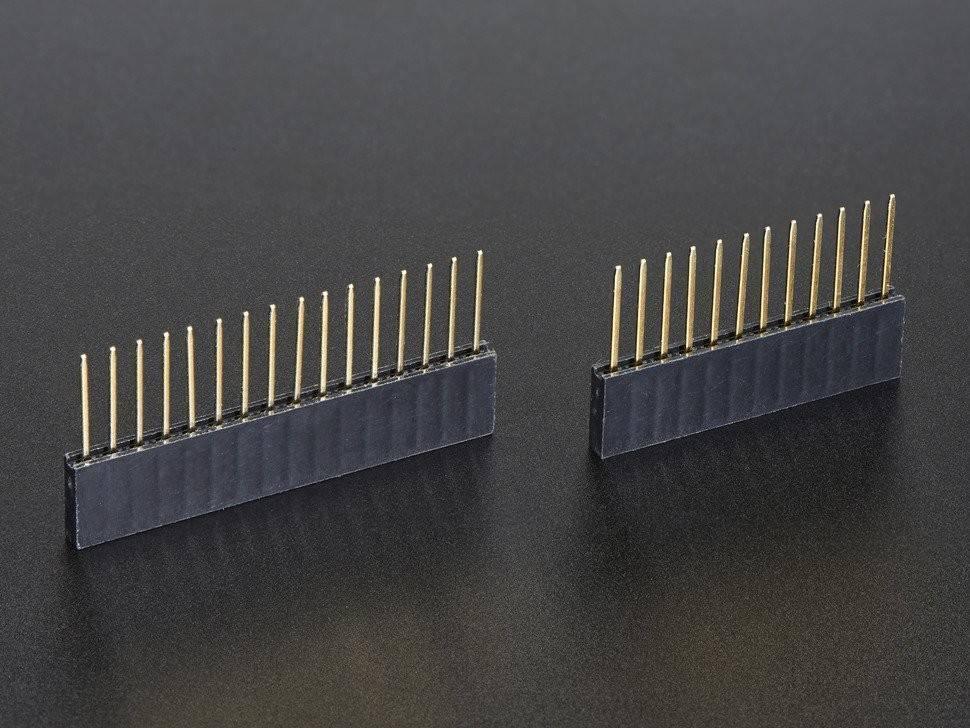 Stackable Arduino Female Header Strip - two black plastic strips with vertical gold-colored metal pins arranged in a single row.