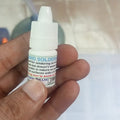 Stainless Steel Flux Soldering Stainless Steel Liquid Solder Soldering Liquid Solution - Liquid Soldering FluxL - Liquid Paste - a small white plastic squeeze bottle held in a hand showing the printed label with product usage instructions.