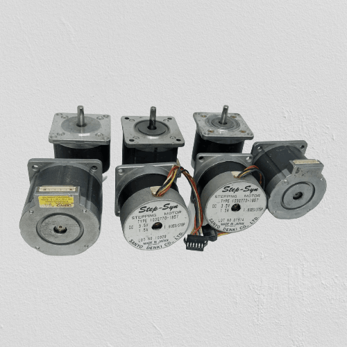 Stepper Motor Round body 4 wire bipolar stepper motor - a group of six grey cylindrical stepper motors with shafts, labels, and some attached wiring connectors.