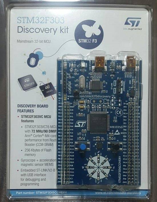 Stm Discovery Kit STM32F3 STM32F303VC With Programming Cable - original plastic retail packaging, showing a blue development board with a central chip, buttons, and LED array.
