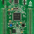 STM32F4 STM32F407 Discovery Kit Arm Cortex-M4 Development Board - a green rectangular development board featuring a central microcontroller, two buttons, USB ports, and pin headers.