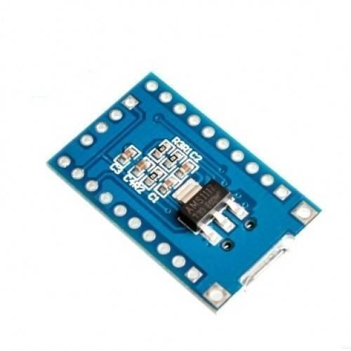 STM8S003F3P6 STM8 Minimum Development Board - a blue rectangular circuit board featuring an AMS1117 voltage regulator, surface-mount components, and pins.