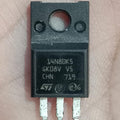STMicroelectronics STF14N80K5 800V 12A N-Channel Power MOSFET (TO-220FP) USED - a black, rectangular electronic component with three metal pins and a mounting hole, shown in a close-up view.