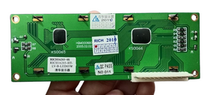 Stock Lot 16x2 Blue/Green LCD in USED CONDITION - the green circuit board rear side with two black IC chips, a white connector, and resistors.