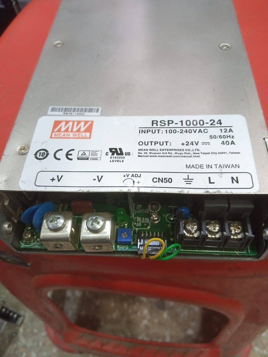 Stock Lot 24V 40A Power Supply - a silver rectangular unit with a terminal block for AC input, DC output, and a voltage adjustment knob on the front panel.