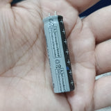 Stock Lot 3.7V 800mAh Lithium Battery 14mm x 50mm 2-Pin Rechargeable (Li-ion Cylindrical Cell) - grey and black battery with two metal pins held in a hand.