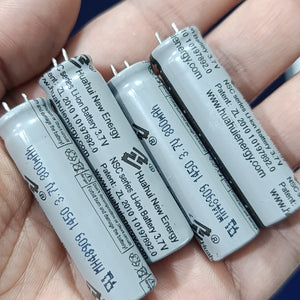 Stock Lot 3.7V 800mAh Lithium Battery 14mm x 50mm 2-Pin Rechargeable (Li-ion Cylindrical Cell) - a close-up of four grey cylindrical Li-ion cells held in a hand.