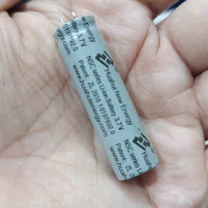 Stock Lot 3.7V 800mAh Lithium Battery 14mm x 50mm 2-Pin Rechargeable (Li-ion Cylindrical Cell) - a close-up of a grey cylindrical Li-ion cell held in a hand, showing printed text.