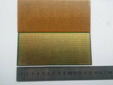 Stripbaord Veroboard Straight Lined Small - shown as two rectangular circuit boards with copper strips and holes, positioned above a metal ruler.
